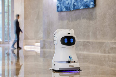 Kleenbot C30 cleaning robot in a commercial lobby, using smart navigation and AI-powered sensors for efficient and autonomous floor cleaning.
