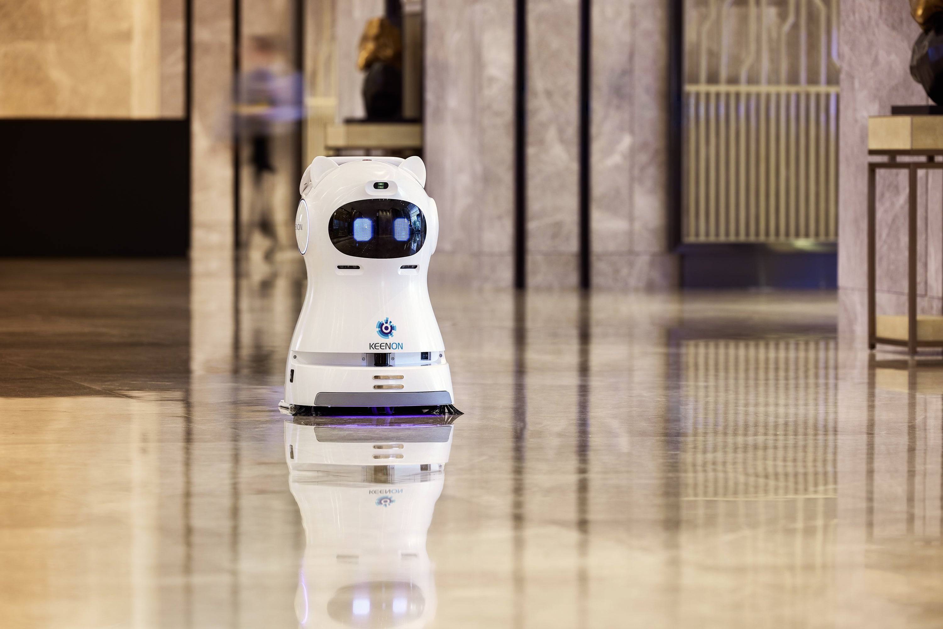 Kleenbot C30 cleaning robot in a luxury hotel setting, ensuring spotless floors with its sweeping, vacuuming, and mopping functions.