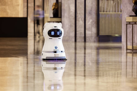 Kleenbot C30 cleaning robot in a luxury hotel setting, ensuring spotless floors with its sweeping, vacuuming, and mopping functions.