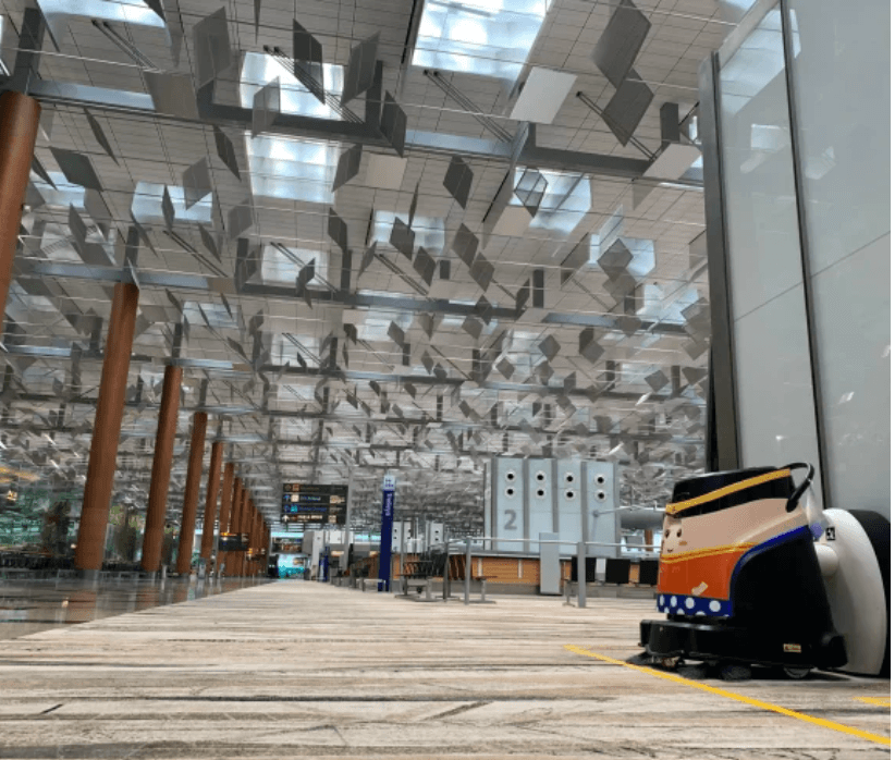 Gausium Vacuum 40 robotic vacuum cleaner operating in a modern airport terminal, ensuring efficient floor cleaning in large open spaces.