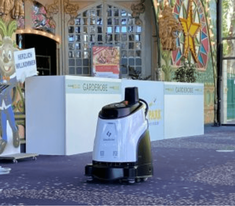 Gausium Vacuum 40 AI cleaning robot in action at an indoor event venue, providing autonomous cleaning in public high-traffic areas.