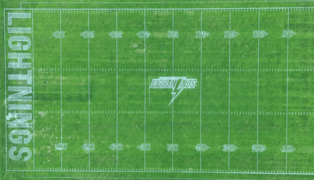 Aerial view of sports field with robotic lawn mower marking
