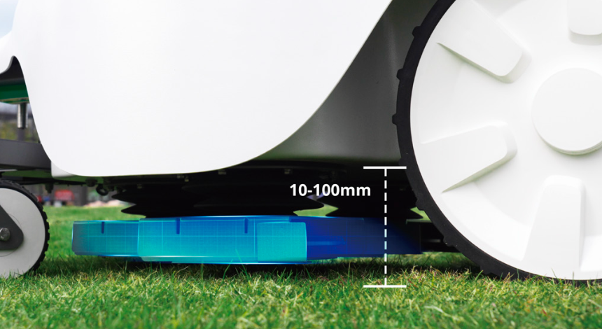 Robotic mower with sensor and dimension details on grass