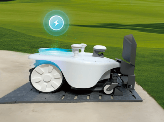 Robotic mower on grass with wireless charging icon