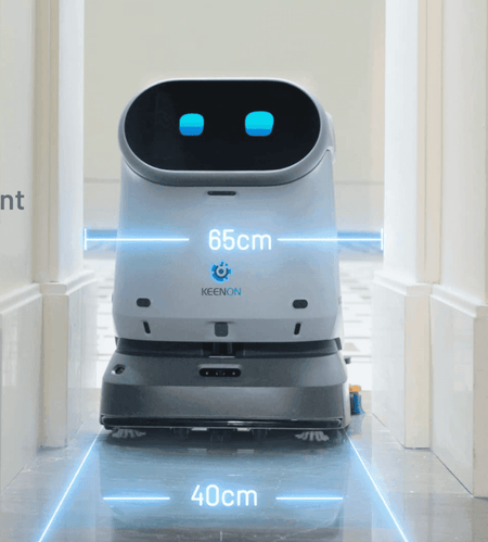 Kleenbot C40 navigating narrow 65cm hallway using smart sensors, designed for tight commercial cleaning spaces.