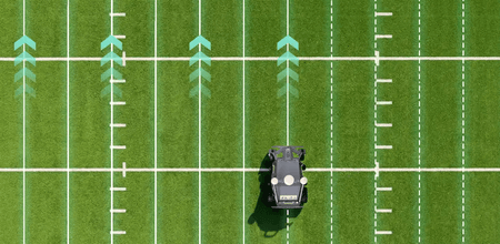 Robotic mower on football field