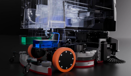 Close-up of robotic cleaning mechanism with brushes and sensors