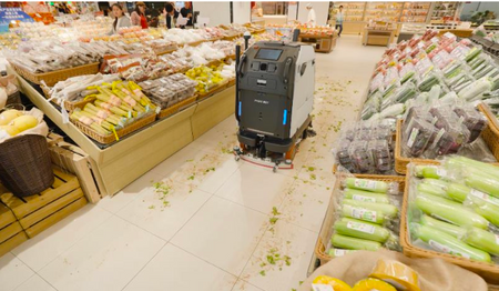 Autonomous cleaning robot in supermarket with spilled produce