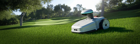Robotic lawn mower on green grass with trees in background